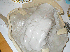 I put up small wall around my piece to keep this next layer of plaster from dripping over the side. I put up small wall around my piece to keep this next layer of plaster from dripping over the side.