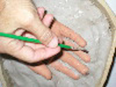 Using a small artist brush and some water smooth out the waterbased clay all around the fingers and surface. Using a small artist brush and some water smooth out the waterbased clay all around the fingers and surface.
