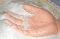 If the fingers are separated you'll have to build up the wall of waterbased clay half way up and smooth it out as well.
